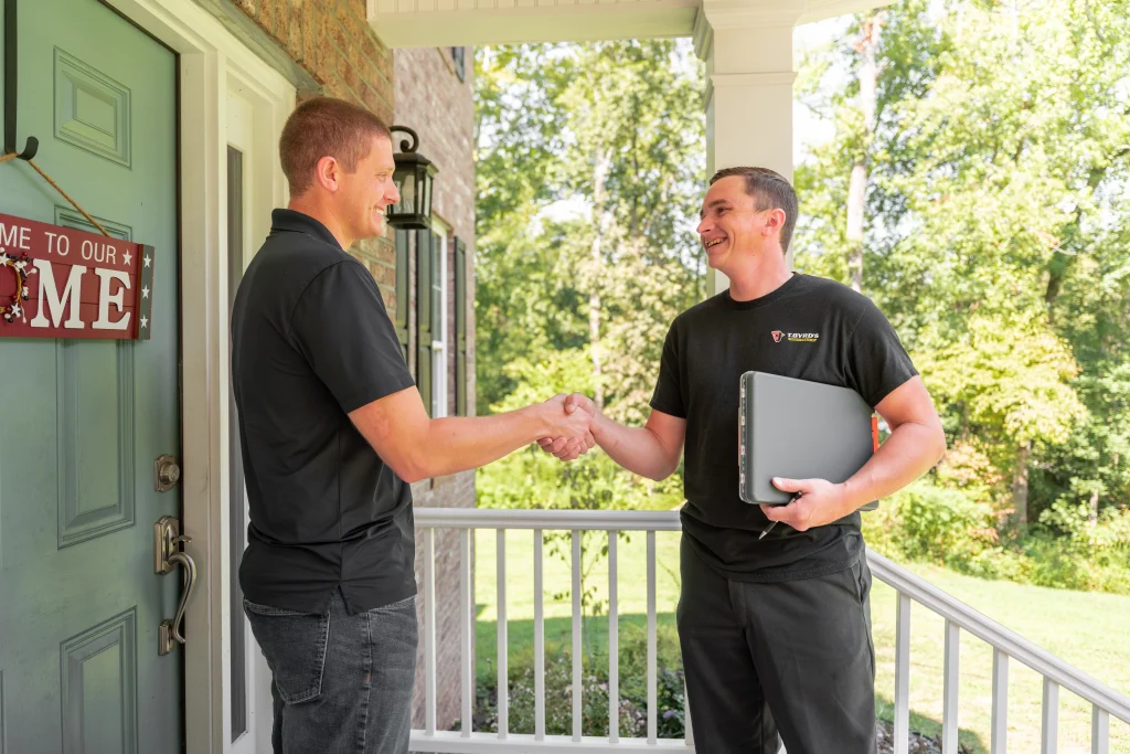 T. Byrd's HVAC techinician greeting a customer